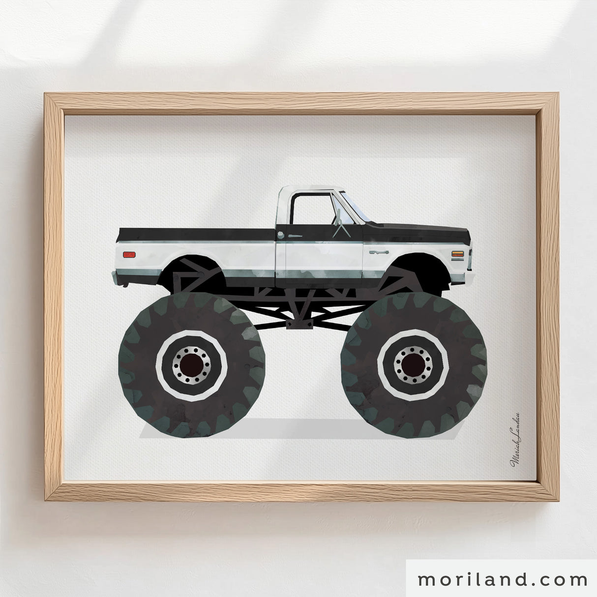 Modern heritage watercolor style illustration of a black and white vintage squarebody pickup truck modified into a monster truck with huge black wheels, displayed in a light wood frame for a nursery or boy's room wall decor by MORILAND.
