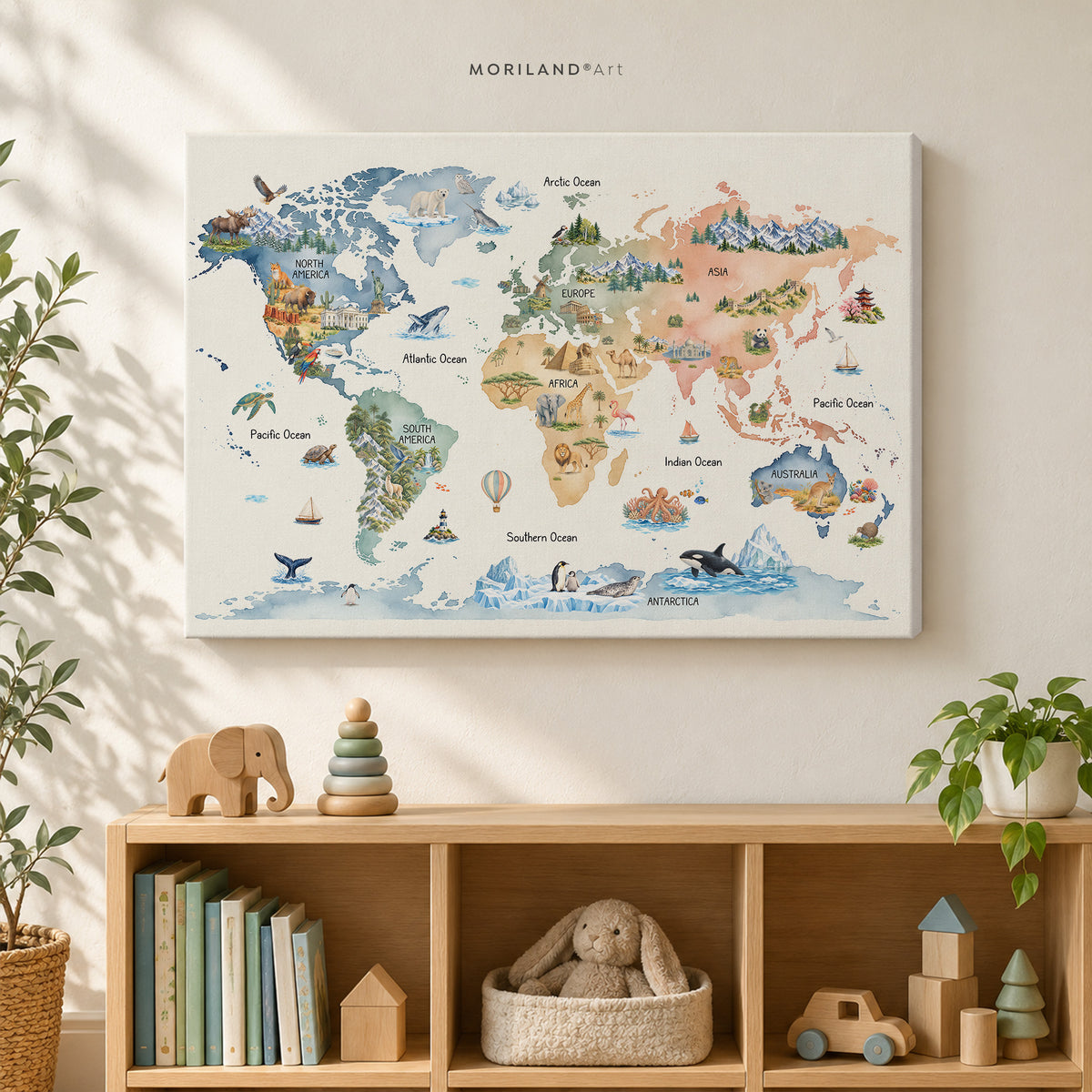 Gallery-wrapped watercolor world map canvas for kids above a light wood playroom shelf with toys, books, and plants.