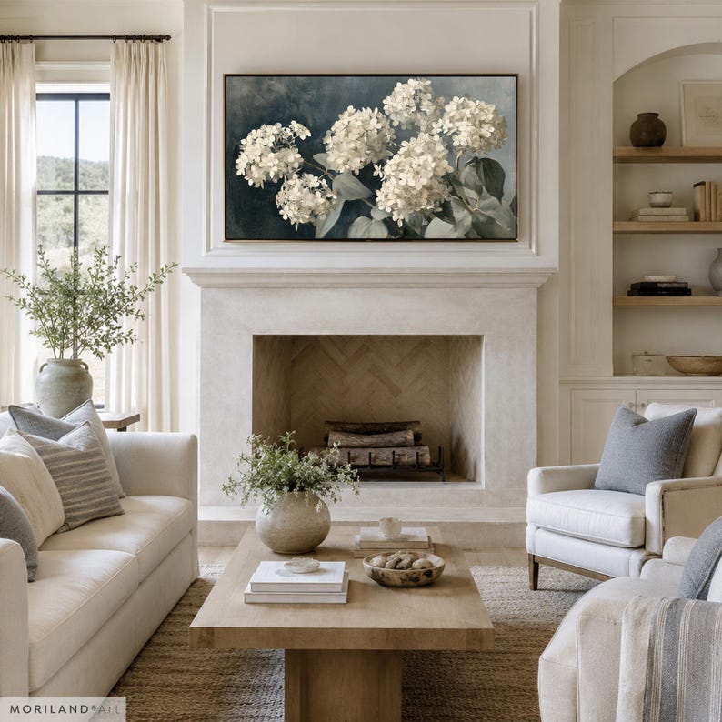 White hydrangea floral painting displayed on Frame TV above fireplace
