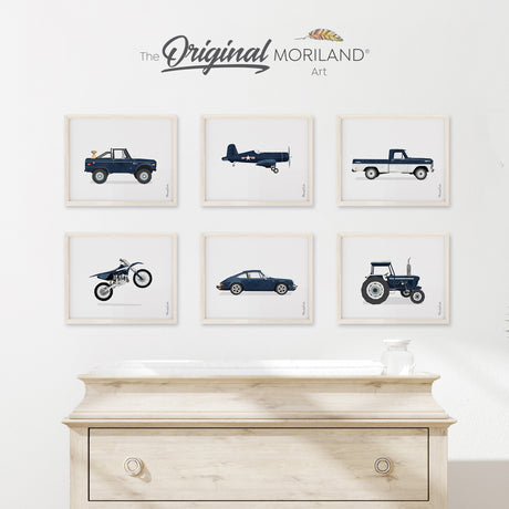 Vintage vehicles fine art prints set for boys' nursery featuring navy blue vintage planes, dirt bikes, classic cars, tractors, and trucks with a playful Labrador dog. By MORILAND