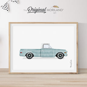 Modern heritage style watercolor illustration of a pale blue 1969 Chevy C10 pickup truck inside a light wood frame, perfect for a classic Chevrolet vehicle nursery or boy's room wall decor by MORILAND.