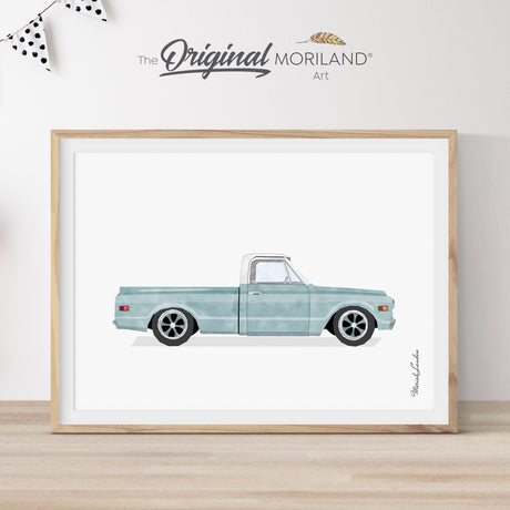 Modern heritage style watercolor illustration of a pale blue 1969 Chevy C10 pickup truck inside a light wood frame, perfect for a classic Chevrolet vehicle nursery or boy's room wall decor by MORILAND.