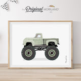 Modern heritage watercolor style illustration of a sage green vintage stepside pickup truck modified into a monster truck with huge black wheels, displayed in a light wood frame for an earthy vehicle nursery or boy's room wall decor by MORILAND.