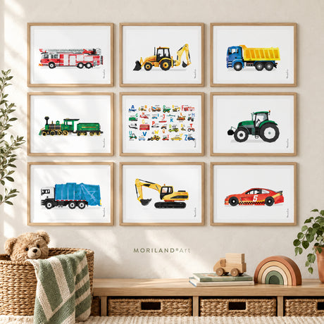 Nine framed MORILAND watercolor vehicle prints featuring a fire truck, backhoe, dump truck, train, tractor, garbage truck, excavator, race car and vehicle ABC art in a modern kids’ playroom.