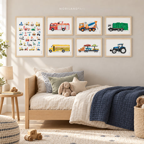 Seven framed MORILAND watercolor vehicle prints featuring an ABC alphabet poster, fire truck, cement mixer, garbage truck, school bus, car transporter and tractor in a modern kids’ bedroom.