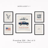 A curated set of 5 patriotic art prints displayed in various frames on a cream wall, featuring a bald eagle and classic blue truck.