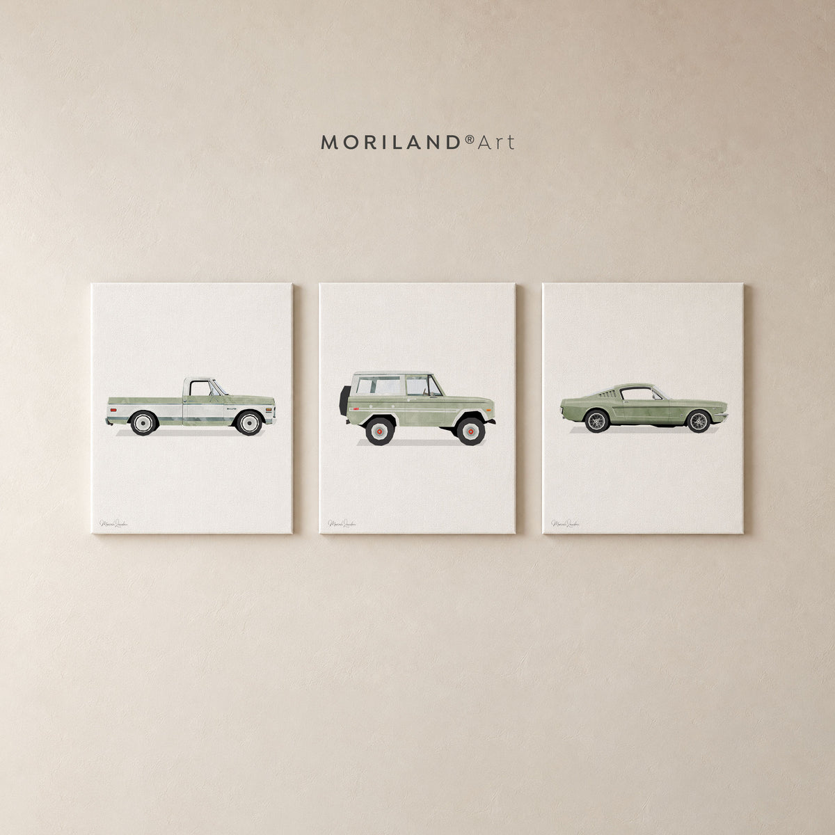 Three wrapped canvases featuring vintage sage green pickup truck, SUV, and sports car artwork arranged as a set on a neutral wall.