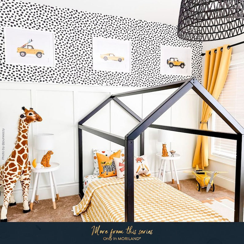 MORILAND vehicle wall art displayed in a yellow and black kids bedroom