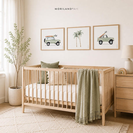Coastal nursery with three sage green surf vehicle and palm tree printable wall art designs above a wood crib