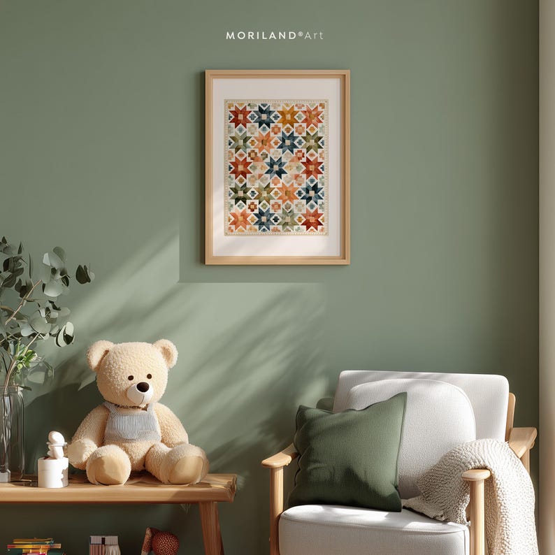 Patchwork star quilt wall art in a sage green reading nook with teddy bear and chair
