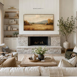Fall landscape Frame TV art displayed above fireplace in neutral living room