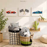 Set of three race car wall art prints displayed in a modern kids' bedroom featuring a vintage red race car, checkered racing flags, and a blue sports car. Perfect for nursery, toddler room, or race car themed decor.
