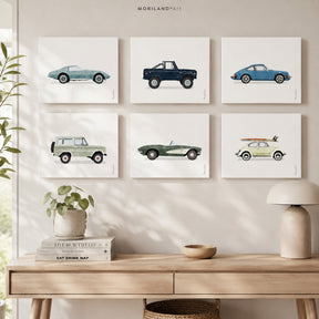 Set of six vintage watercolor car prints displayed in a modern Scandinavian-style room above a light wood console table.