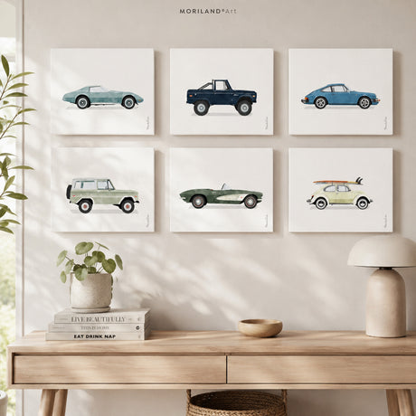 Set of six vintage watercolor car prints displayed in a modern Scandinavian-style room above a light wood console table.